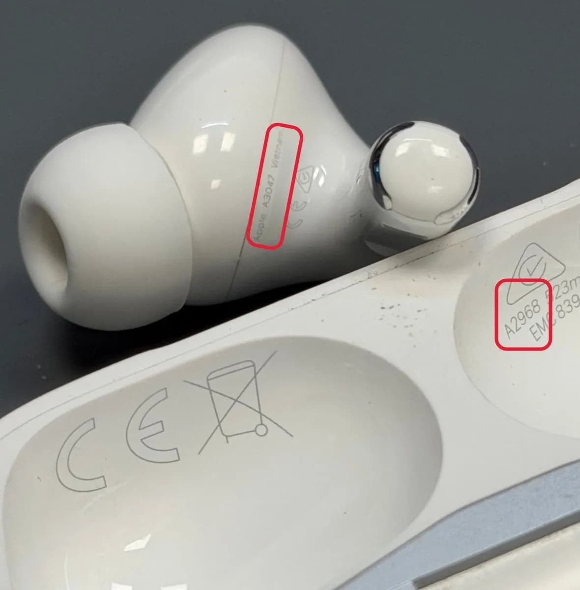 AirPods Pro earbud with the number A3047 and the case lid with the number A2968