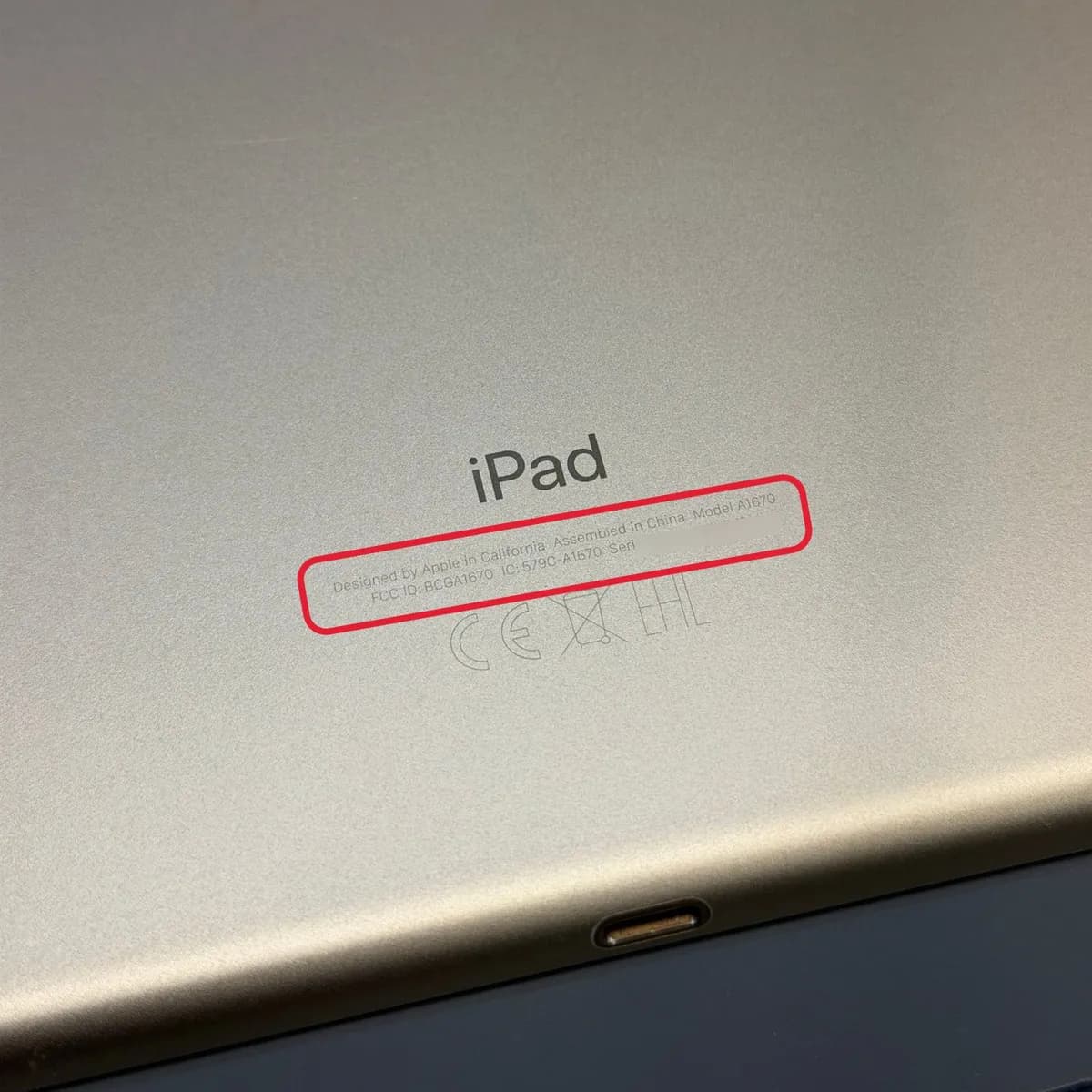Back of an iPad with the small text below the iPad lettering highlighted
