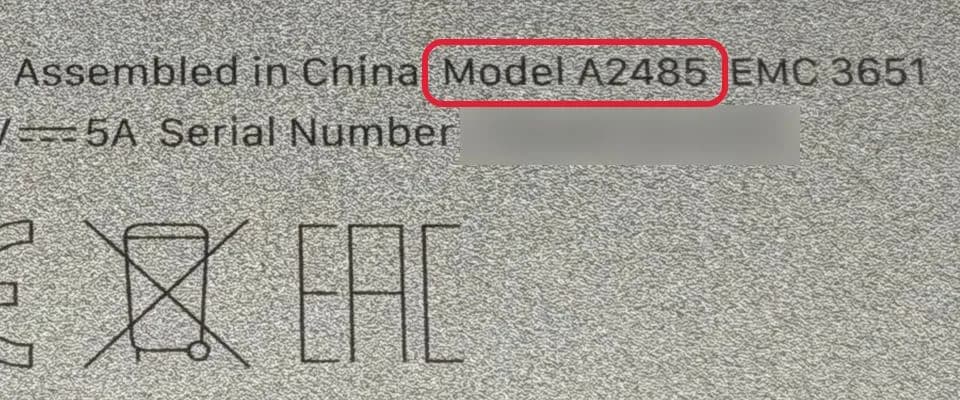 Close-up of the text on the bottom of a MacBook with Model A2485 highlighted