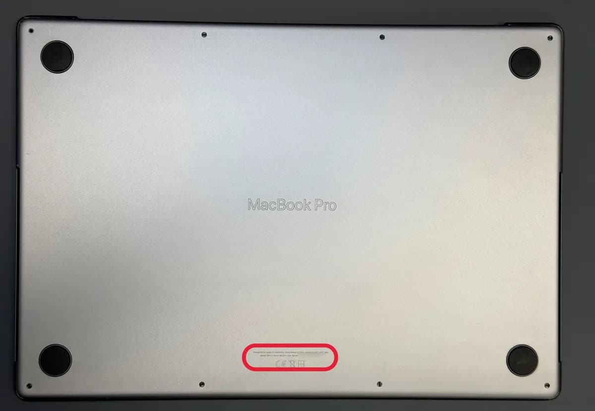 Bottom of a MacBook with the small text near the edge highlighted